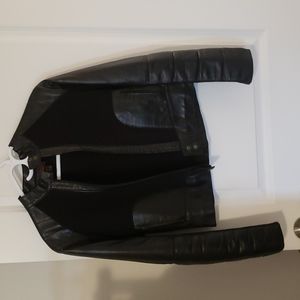 Black leather and material mix short jacket. Size extra small. BRAND is Danier.